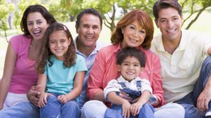 Colorado Springs Dental Extended family sitting outdoors smiling